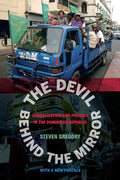 The Devil Behind the Mirror: Globalization and Politics in the Dominican Republic - Paperback